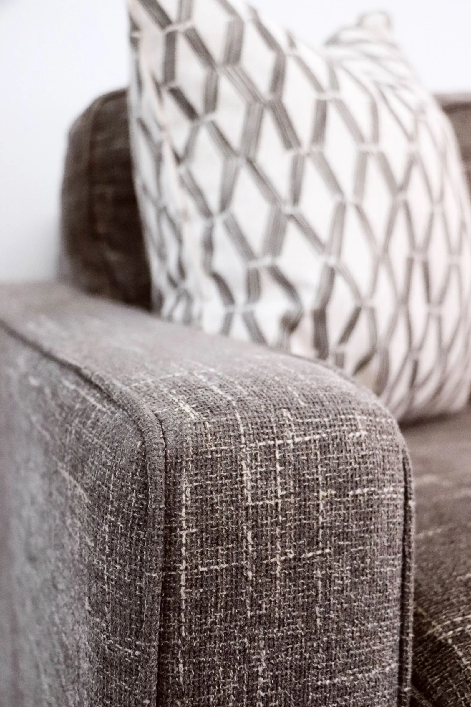 Illustrative close view of upholstery texture and armrest seam