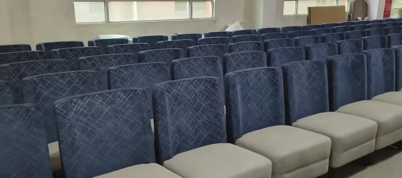Blue upholstered seating arranged in batches in the workshop