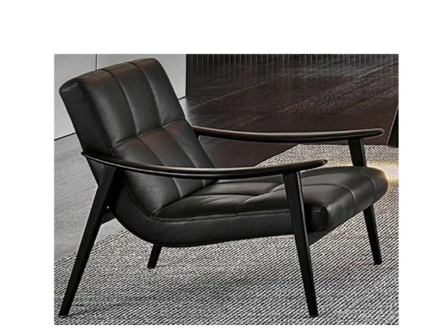 Tailored grey open-frame lounge chair with loose upholstered cushions
