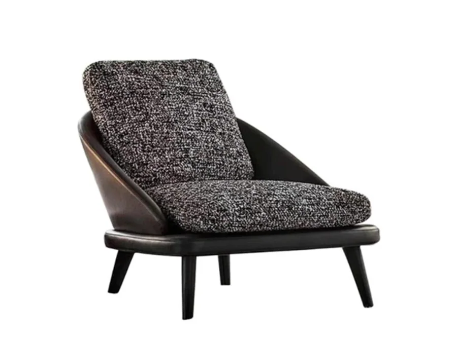 Deep textured lounge chair with dark sculpted outer shell and splayed legs