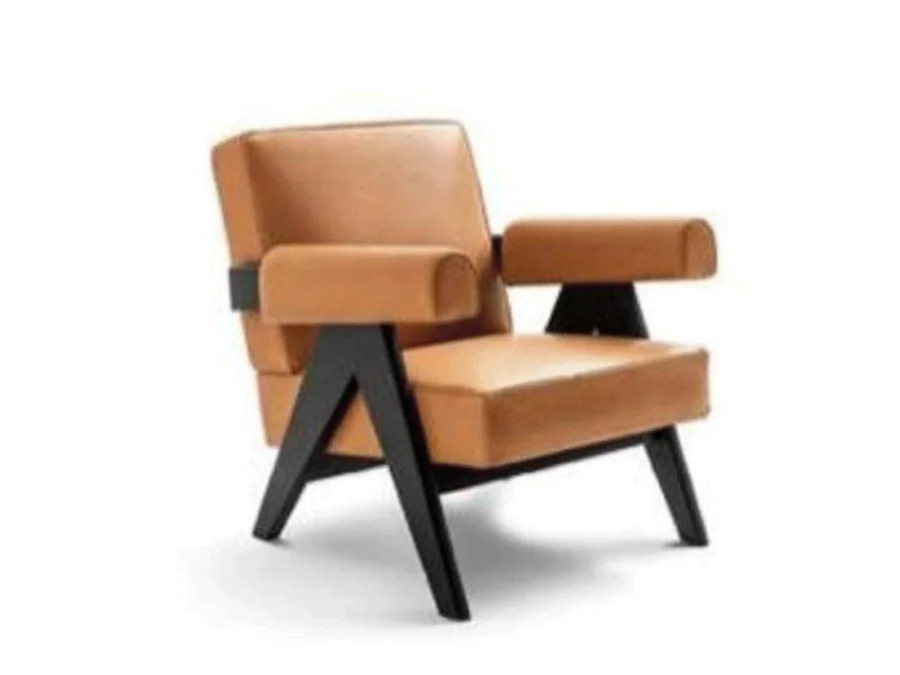 Tan architectural lounge chair with block cushions and angular dark wood arms