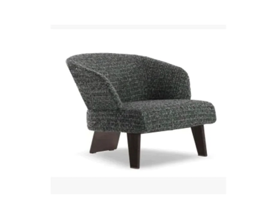 Compact grey lounge chair with low rounded back and flared dark side-panel feet