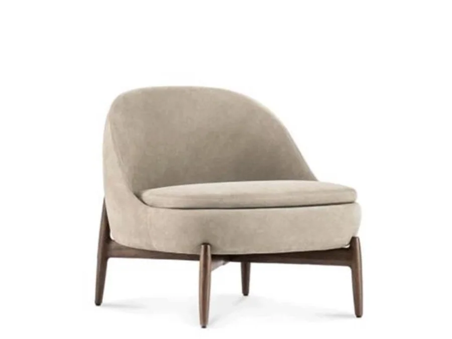 Low rounded cream lounge chair supported by an exposed dark wood cradle base