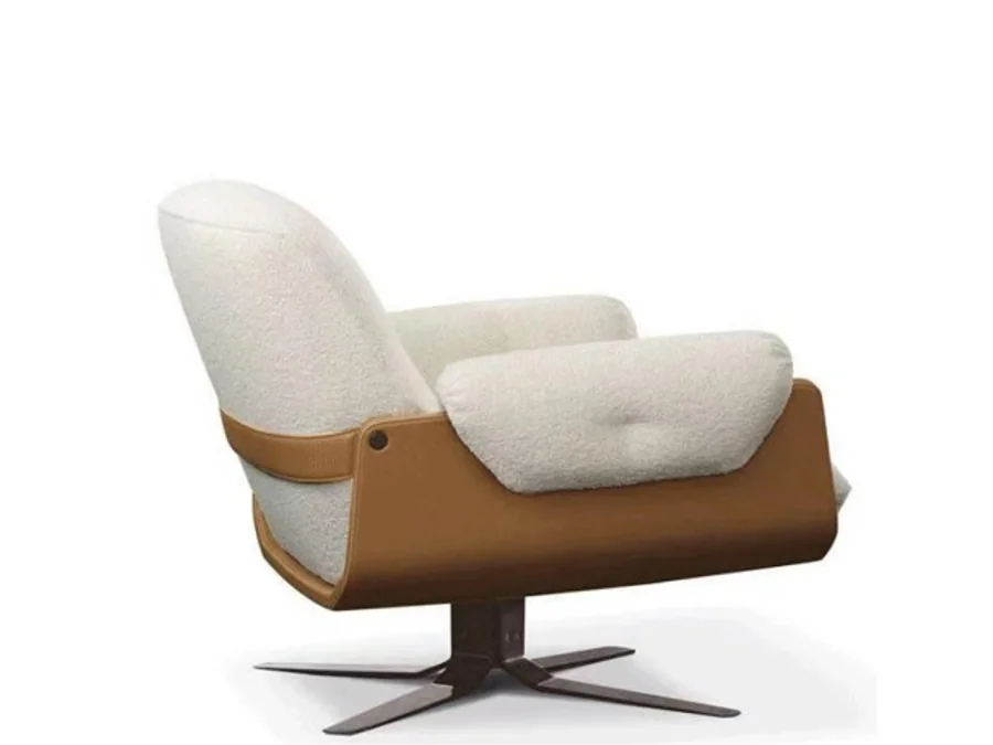 Cream swivel lounge chair with saddle-wrapped outer shell and dark metal star base