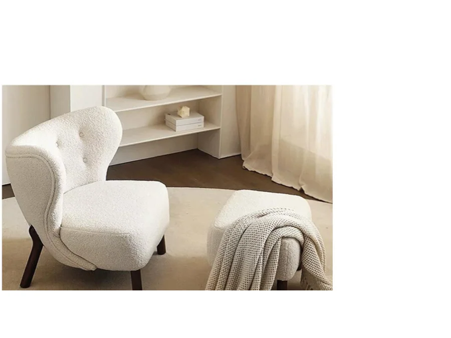 Compact cream high-back lounge chair with dark wood legs and matching ottoman
