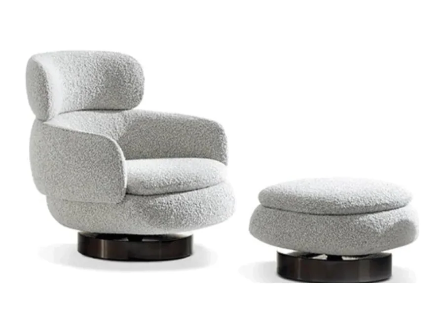 White segmented high-back swivel lounge chair with matching pedestal ottoman