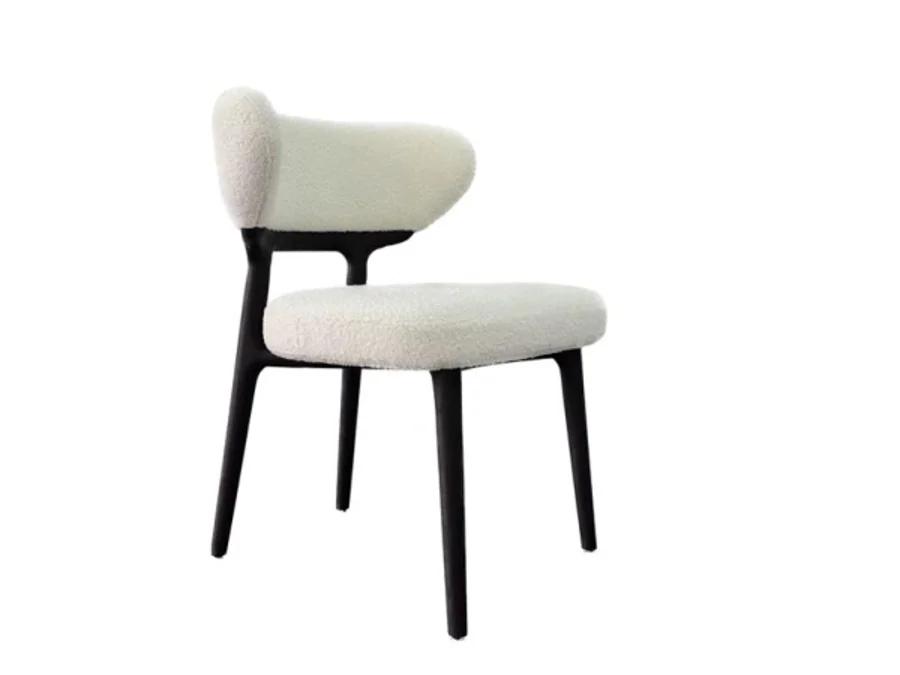 Compact dining chair with open wing-shaped upholstered back and dark legs