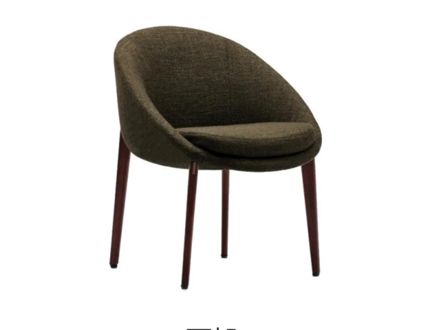 Compact oval upholstered dining chair with tapered dark wood legs