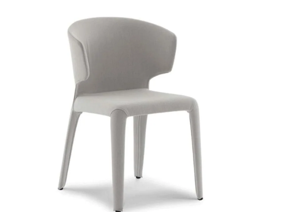 Monolithic light grey curved shell dining chair with integrated legs