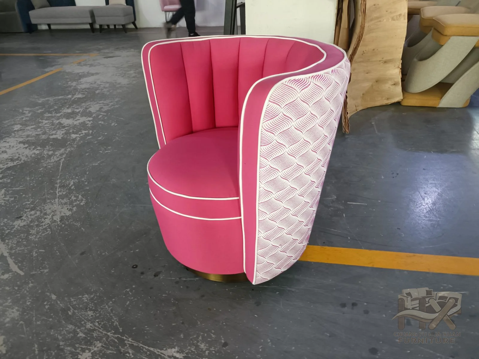 A fan-shaped back opens widely above a compact round seat; pink, pale blue and orange photographs show upholstery variations of the same shell.