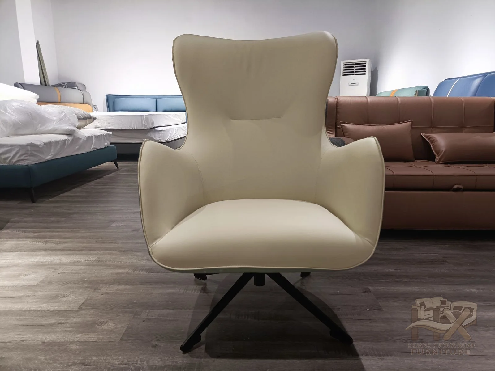 A high pale back curves around a narrow seat and raised arms above a dark swivel base.