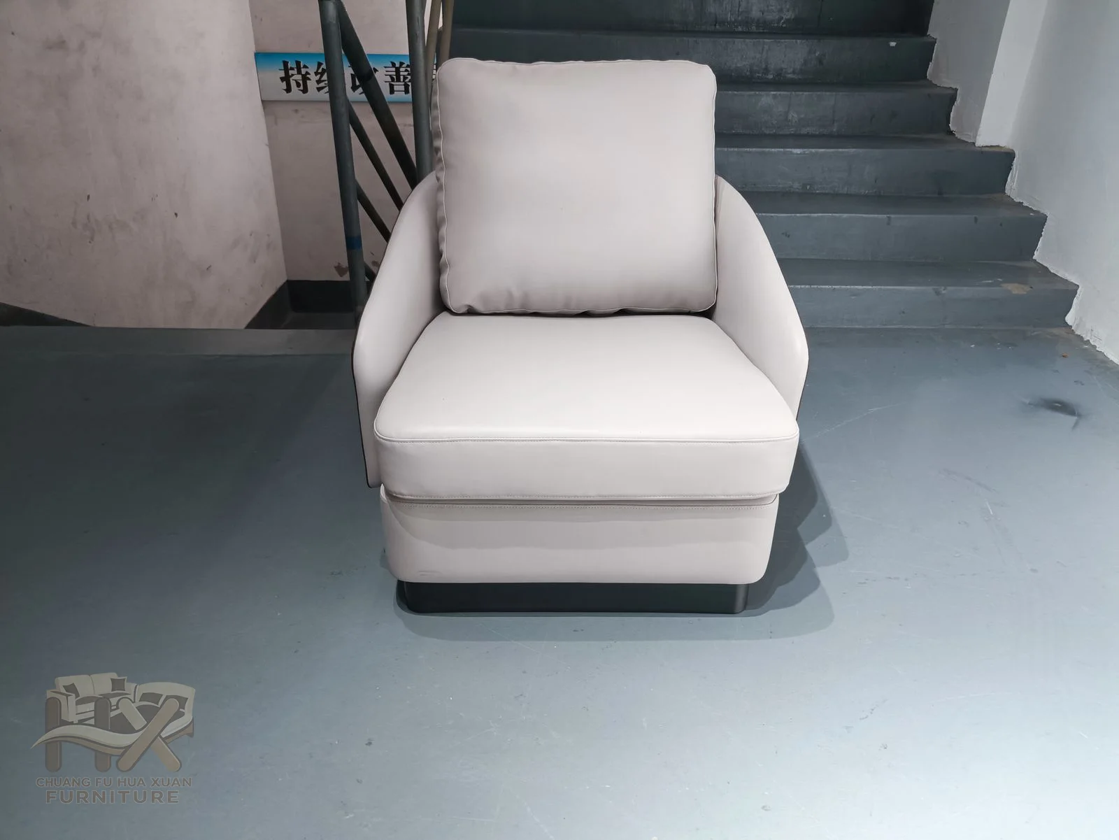 A pale contoured seat is bordered by a warm brown outer shell, with a long inclined back and low enclosed base.