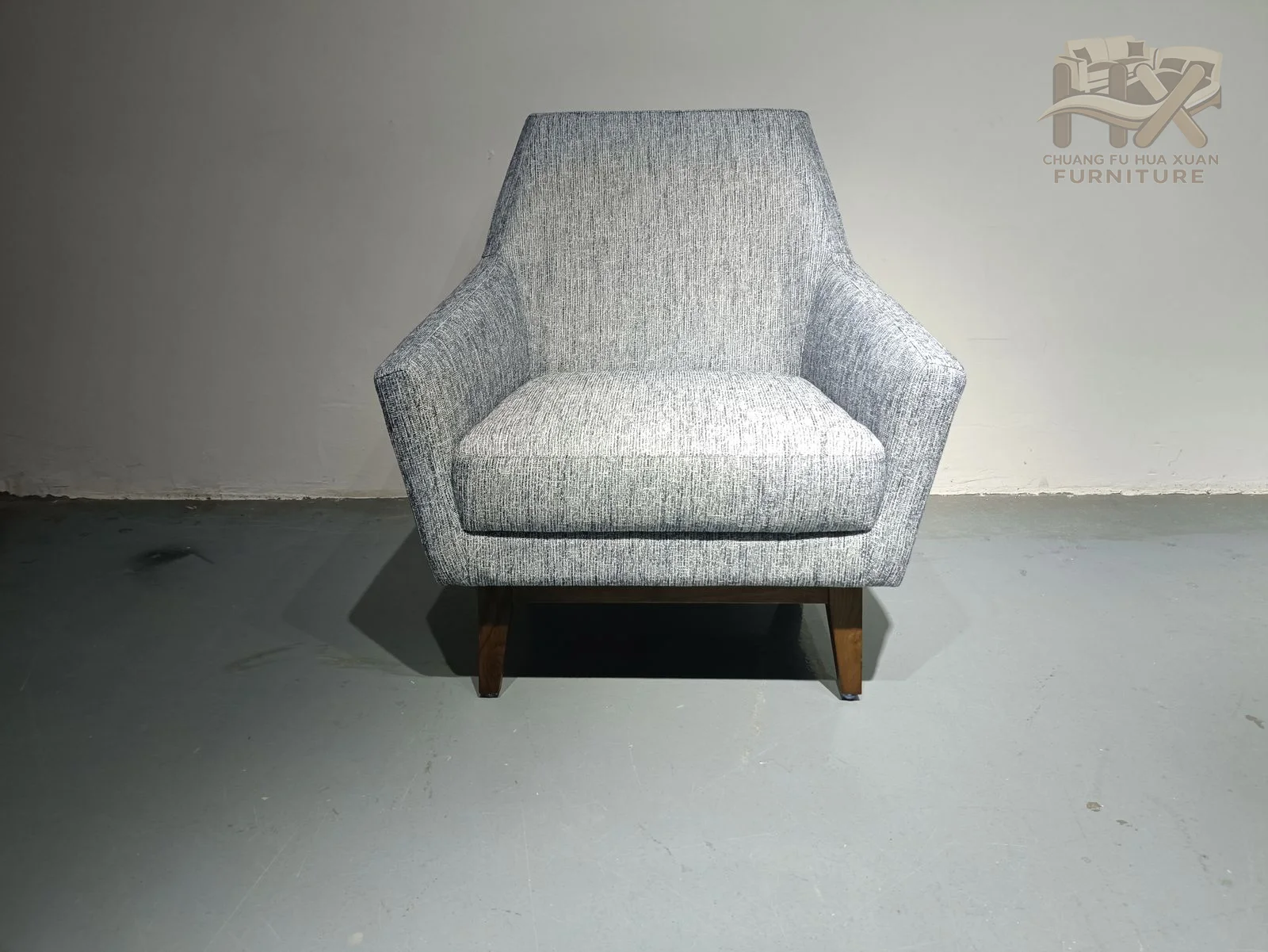 A narrow high back rises from a compact pale blue seat above a dark hidden base.