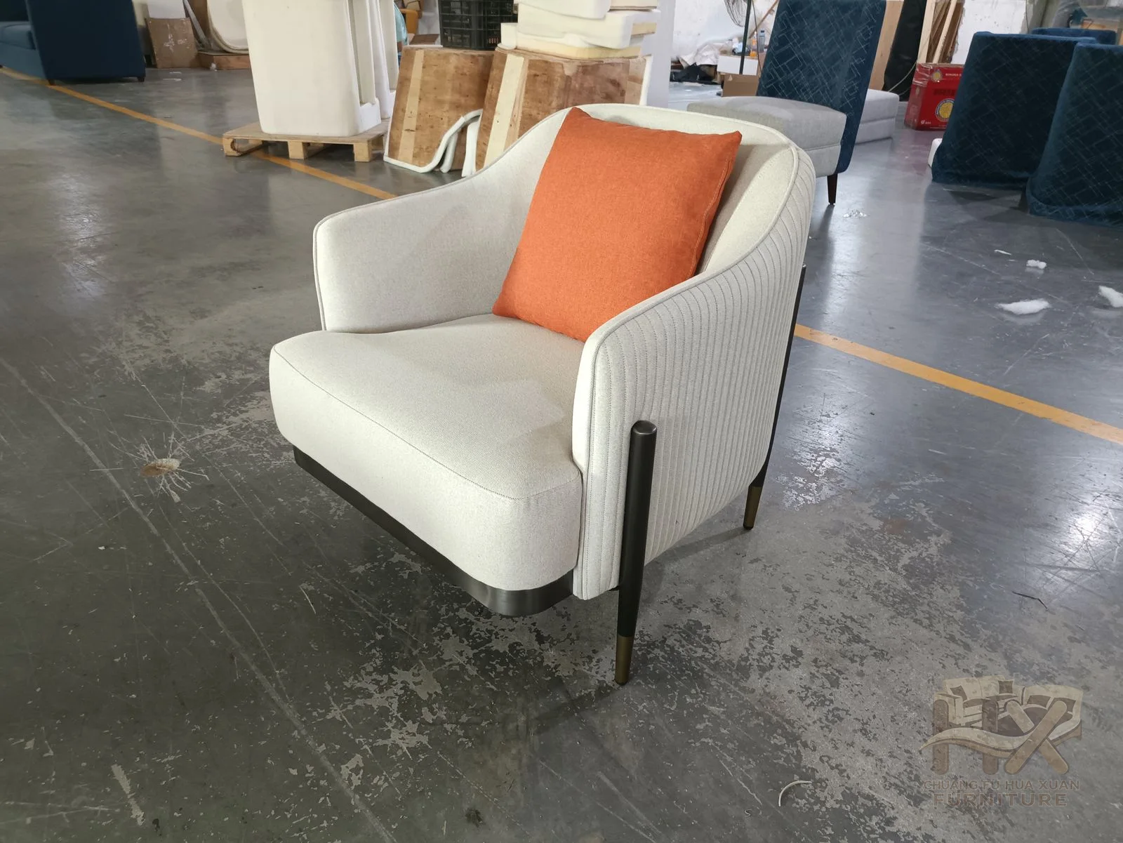 A pale wraparound shell holds a bright coral rectangular back cushion above a compact seat.