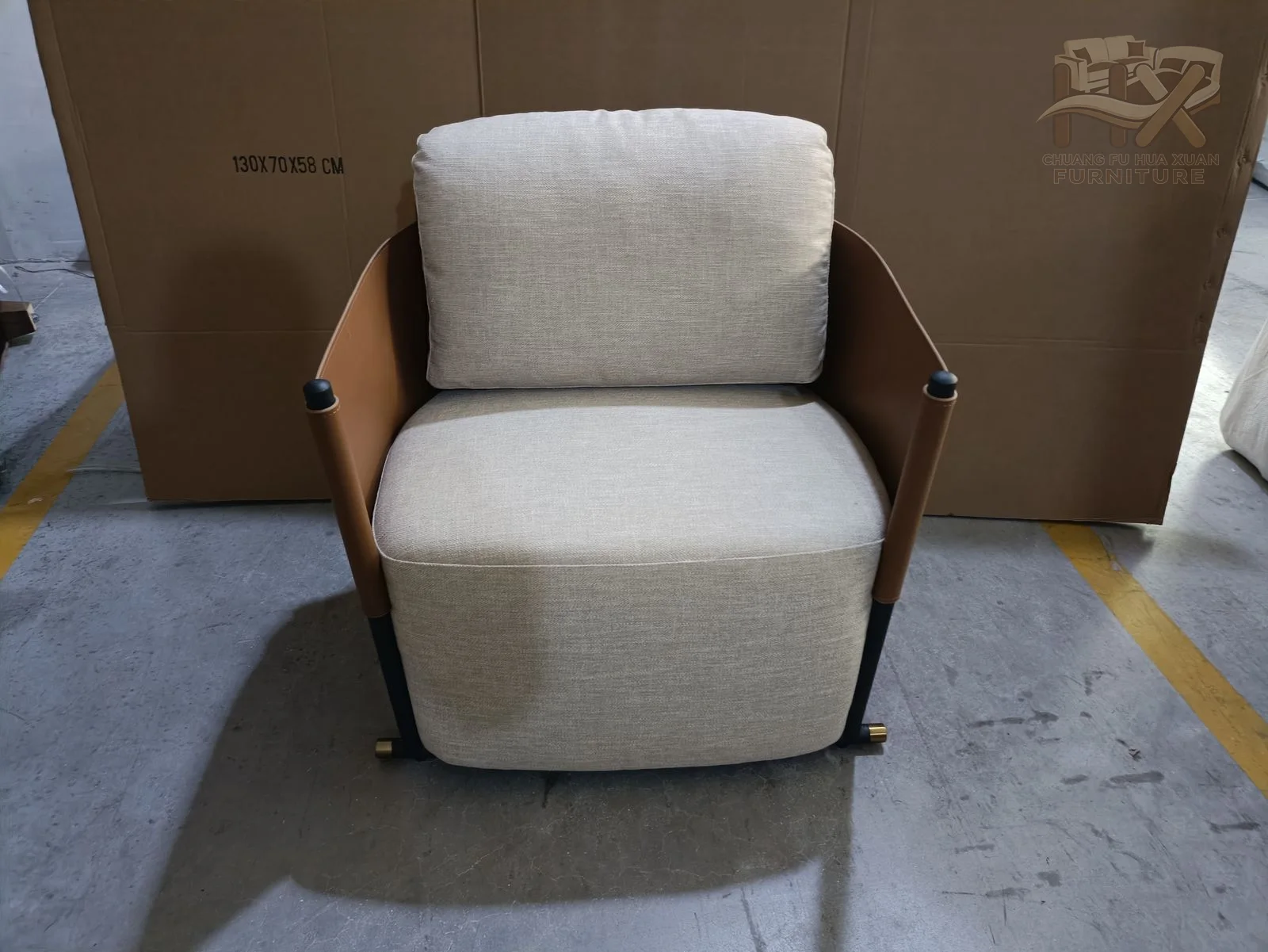 A pale front seat is wrapped by a darker brown outer back above a concealed swivel base.
