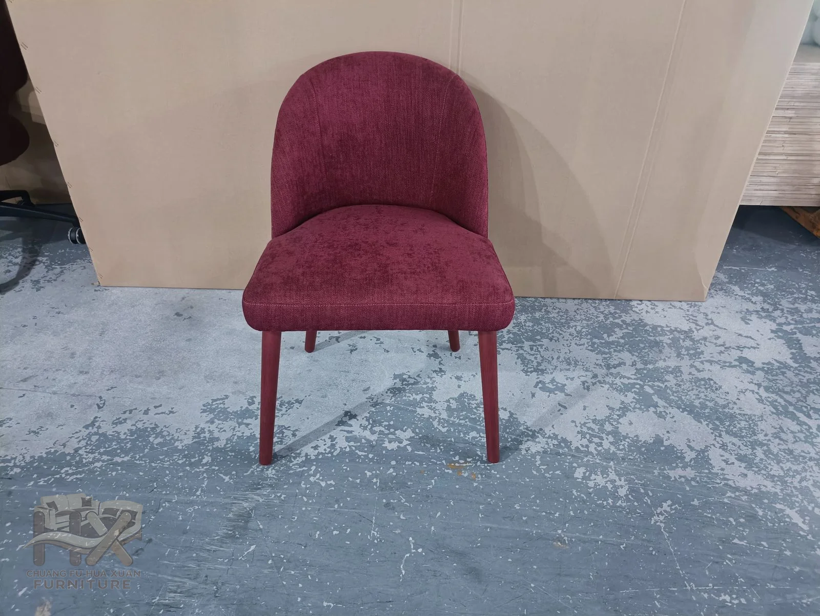 A close-fitting rose-coloured curved back rests above a small seat and fine matching legs.