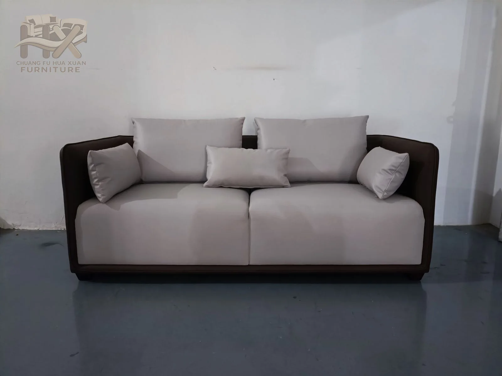 Pale seat cushions contrast with a darker outer frame and square arms, shown across related sofa widths.