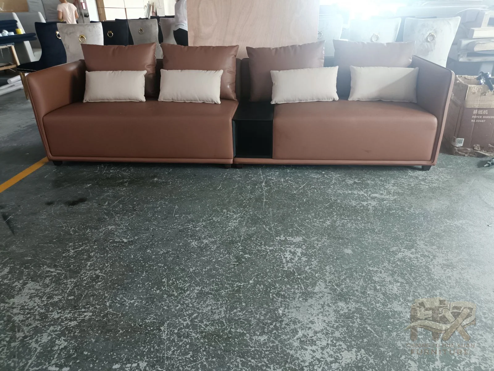 Brown modules create a broad low corner sofa with deep square seats and loose back cushions.