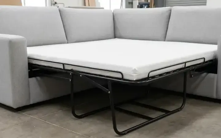 Open sofa bed showing the pull-out sleeping platform and metal support frame