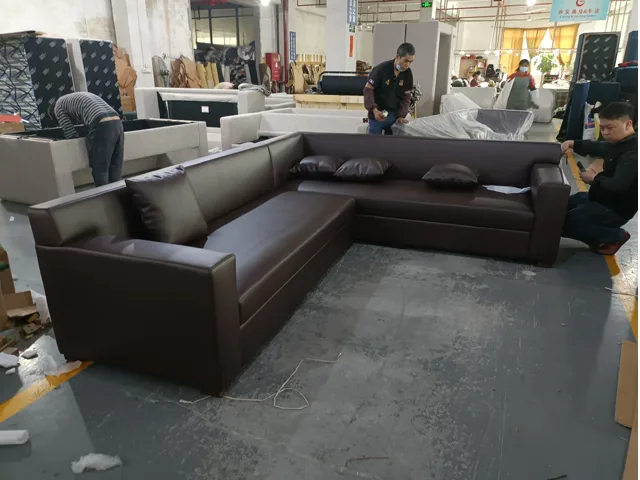Dark brown sectional sofa arrangement shown during workshop review
