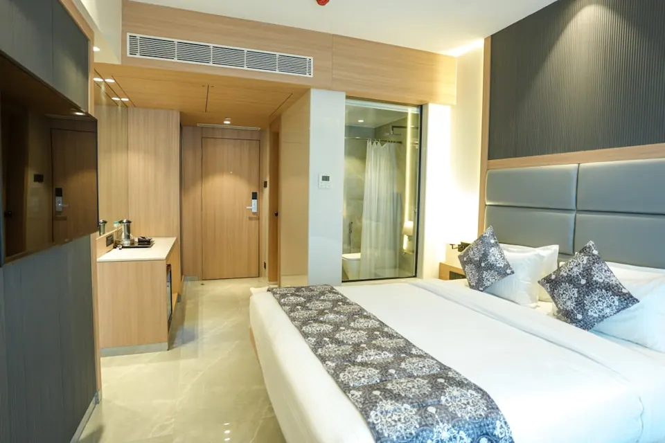 Hotel bedroom furniture package showing bed, headboard and coordinated bedside furniture