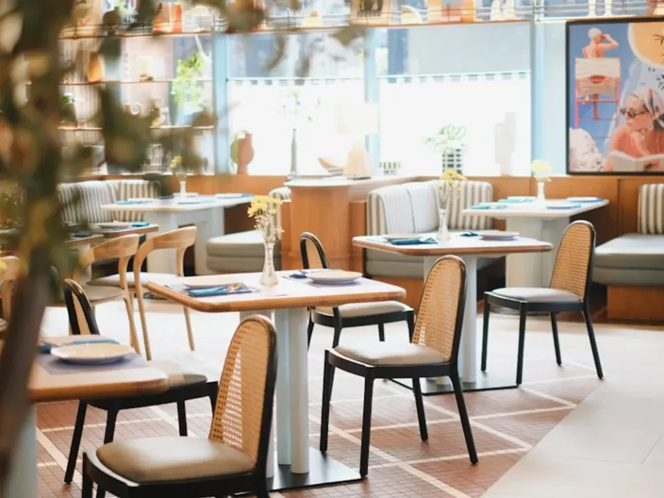 Commercial restaurant dining area with chairs, tables and booth seating