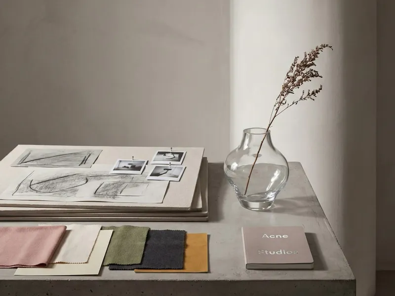 Illustrative material samples and product specification references on a desk